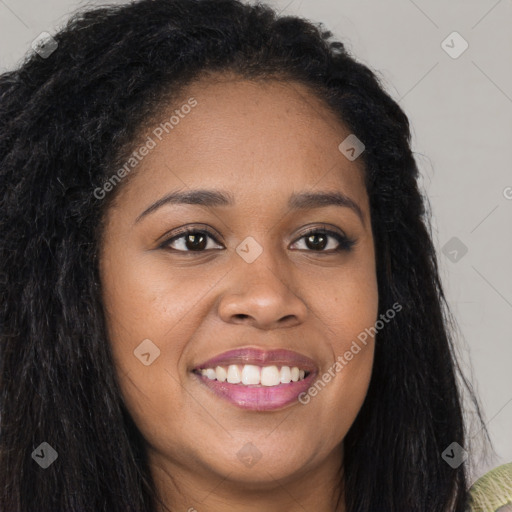 Joyful black young-adult female with long  brown hair and brown eyes