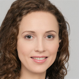 Joyful white young-adult female with long  brown hair and green eyes