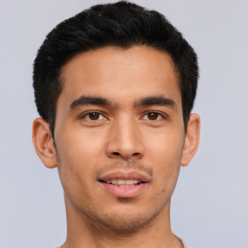 Joyful asian young-adult male with short  brown hair and brown eyes