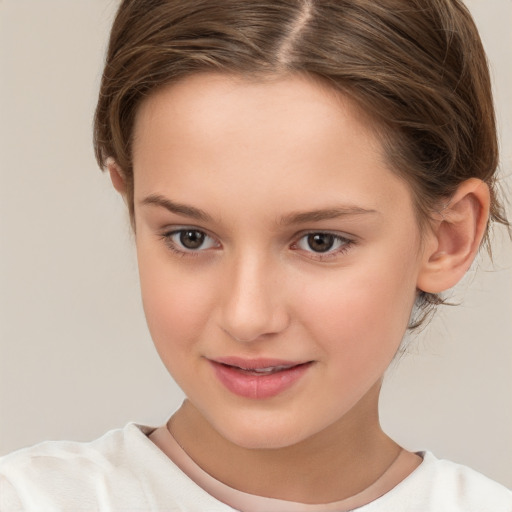 Joyful white child female with short  brown hair and brown eyes