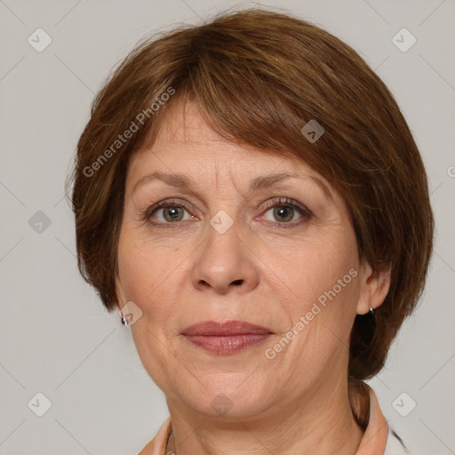 Joyful white adult female with medium  brown hair and grey eyes