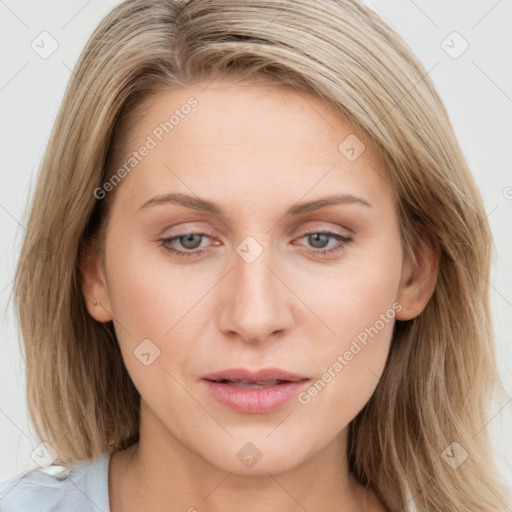 Joyful white young-adult female with long  brown hair and blue eyes