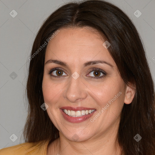 Joyful white adult female with medium  brown hair and brown eyes