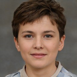 Joyful white child female with short  brown hair and brown eyes