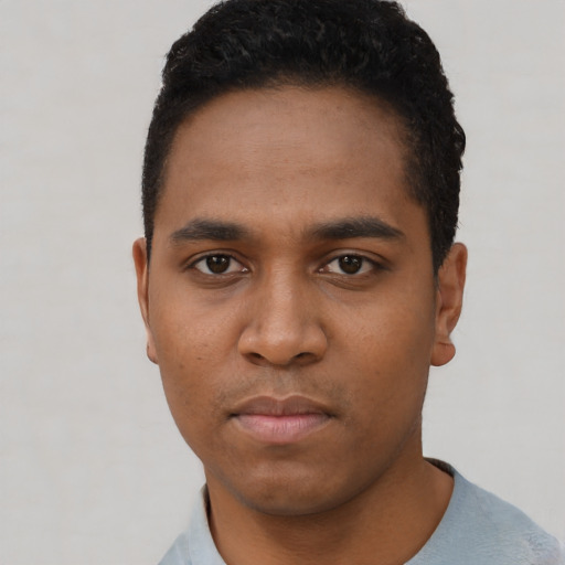 Neutral black young-adult male with short  black hair and brown eyes