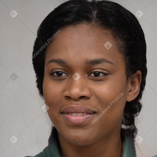 Joyful black young-adult female with long  black hair and brown eyes