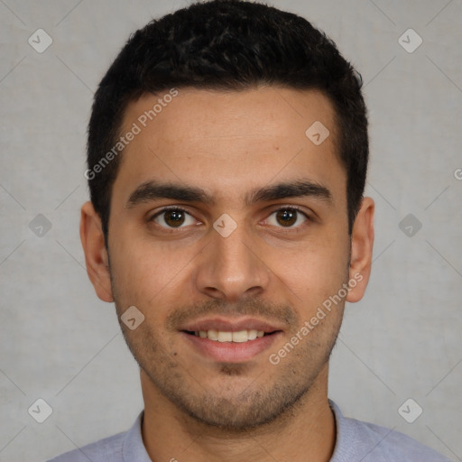 Joyful white young-adult male with short  black hair and brown eyes