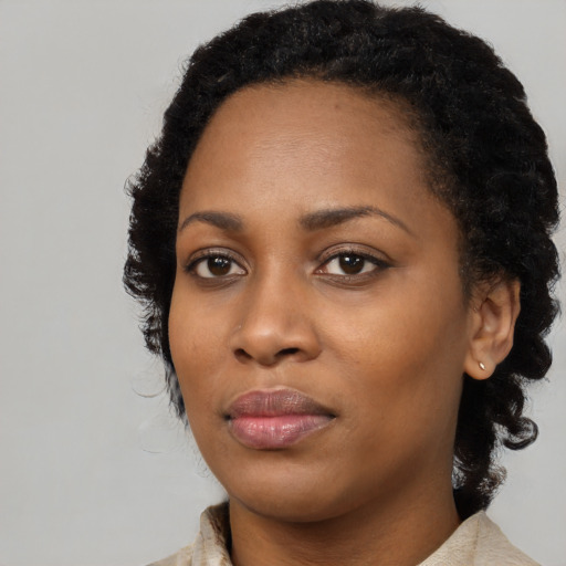 Neutral black young-adult female with medium  black hair and brown eyes