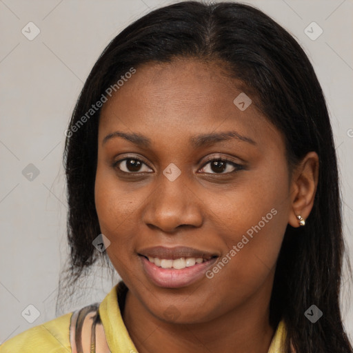 Joyful latino young-adult female with long  brown hair and brown eyes