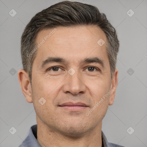 Joyful white adult male with short  brown hair and brown eyes