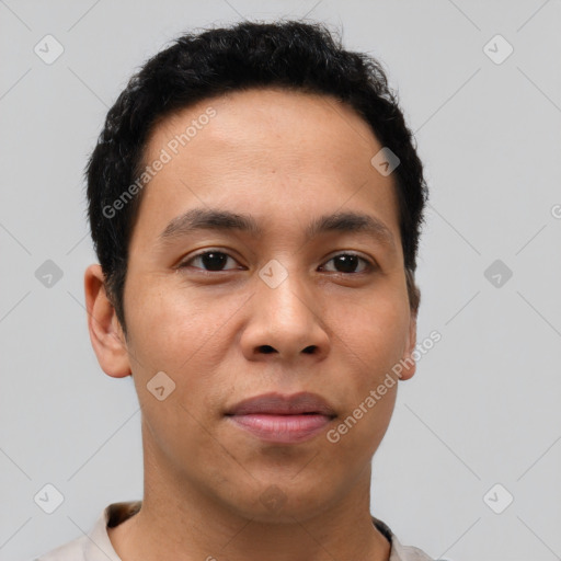 Joyful latino young-adult male with short  brown hair and brown eyes