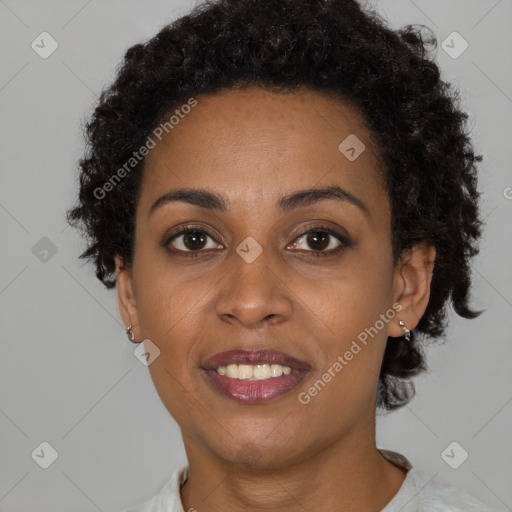 Joyful black young-adult female with short  brown hair and brown eyes