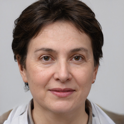 Joyful white adult female with medium  brown hair and brown eyes