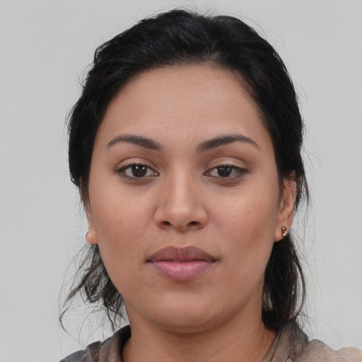 Neutral latino young-adult female with medium  brown hair and brown eyes