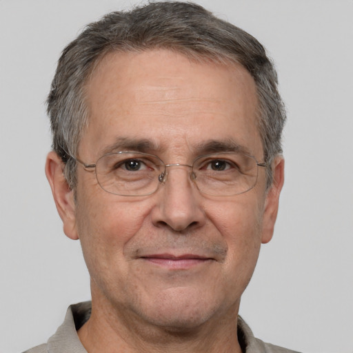 Joyful white middle-aged male with short  gray hair and brown eyes