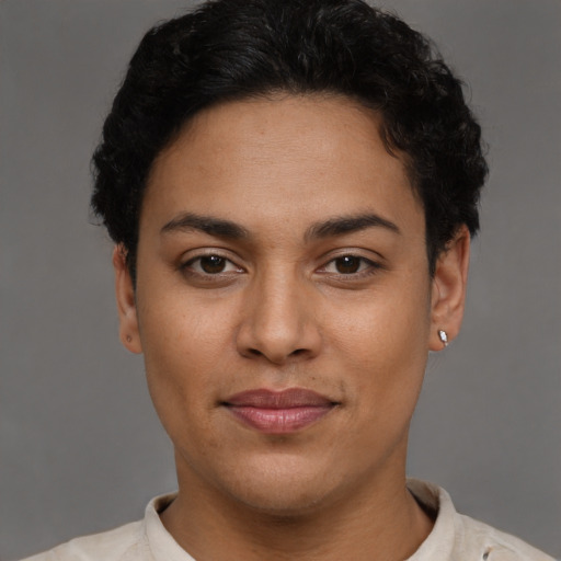 Joyful latino young-adult female with short  brown hair and brown eyes