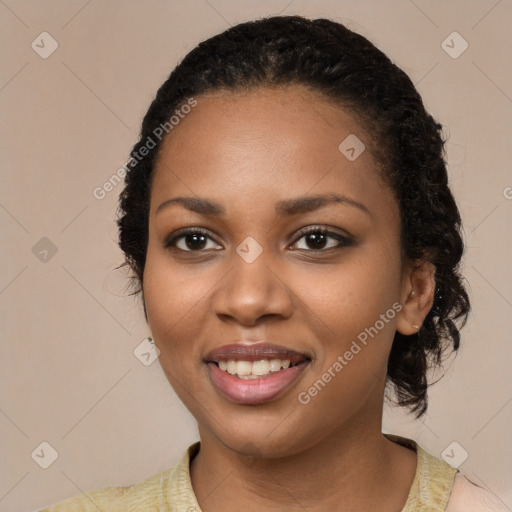 Joyful black young-adult female with medium  black hair and brown eyes