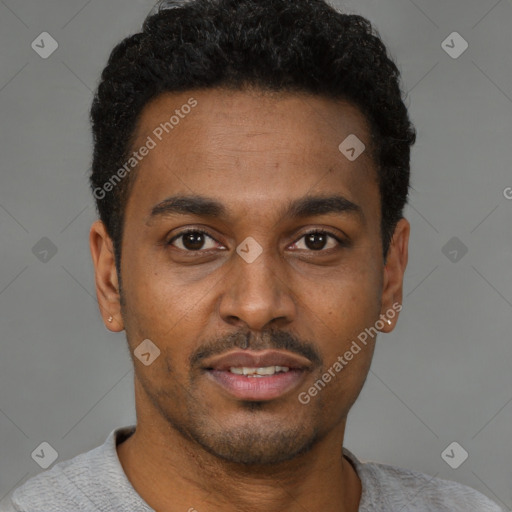 Joyful latino young-adult male with short  brown hair and brown eyes