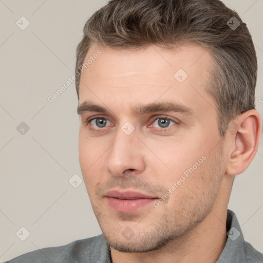 Joyful white adult male with short  brown hair and brown eyes