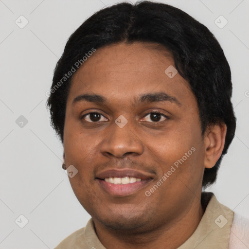 Joyful black young-adult male with short  black hair and brown eyes