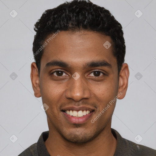 Joyful black young-adult male with short  black hair and brown eyes