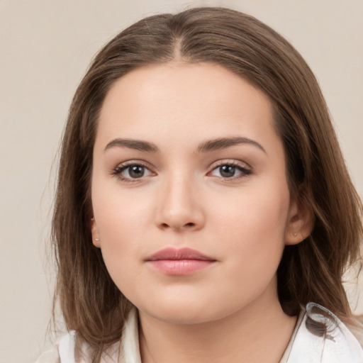 Neutral white young-adult female with medium  brown hair and brown eyes