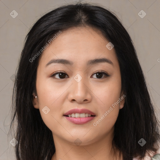 Joyful asian young-adult female with long  brown hair and brown eyes