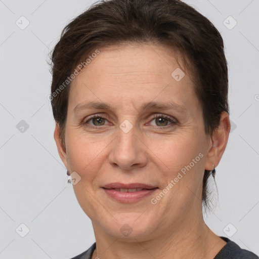 Joyful white adult female with short  brown hair and brown eyes