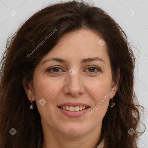 Joyful white adult female with long  brown hair and brown eyes