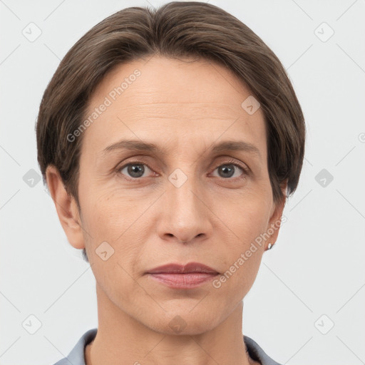 Joyful white adult female with short  brown hair and grey eyes