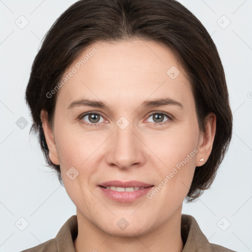 Joyful white young-adult female with medium  brown hair and grey eyes