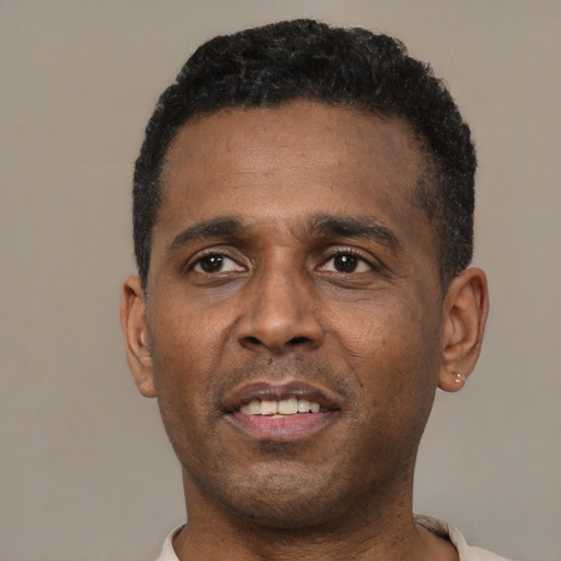 Neutral black adult male with short  black hair and brown eyes