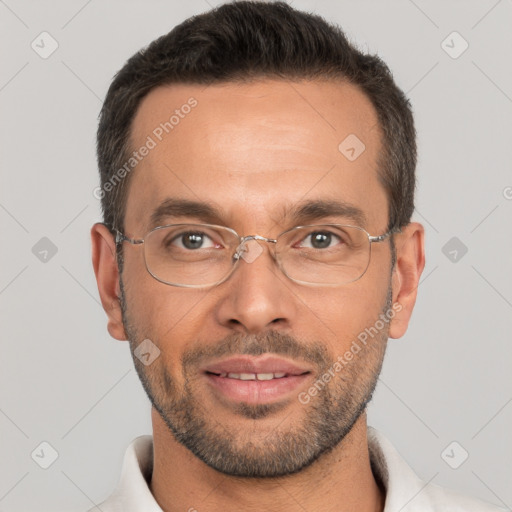 Joyful white adult male with short  brown hair and brown eyes