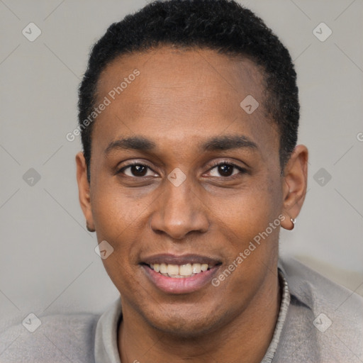 Joyful black young-adult male with short  black hair and brown eyes