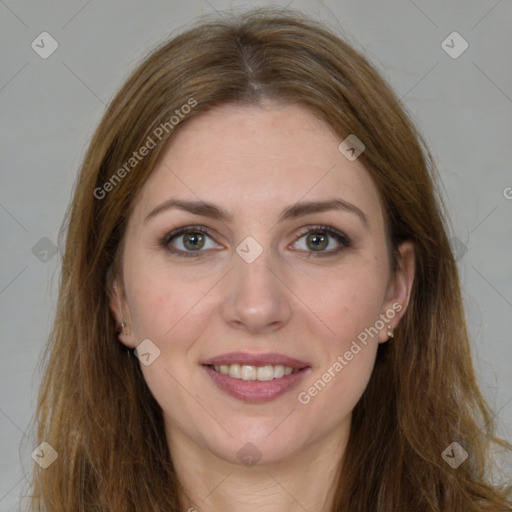 Joyful white young-adult female with long  brown hair and green eyes