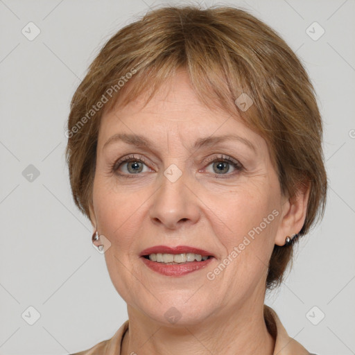 Joyful white adult female with medium  brown hair and grey eyes