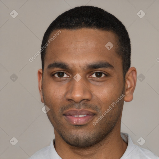 Joyful black young-adult male with short  black hair and brown eyes