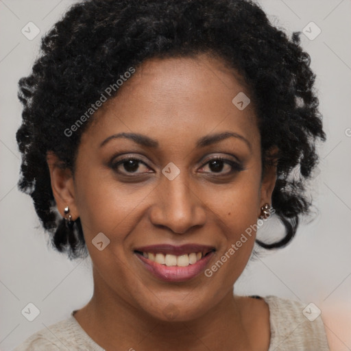 Joyful black adult female with short  brown hair and brown eyes