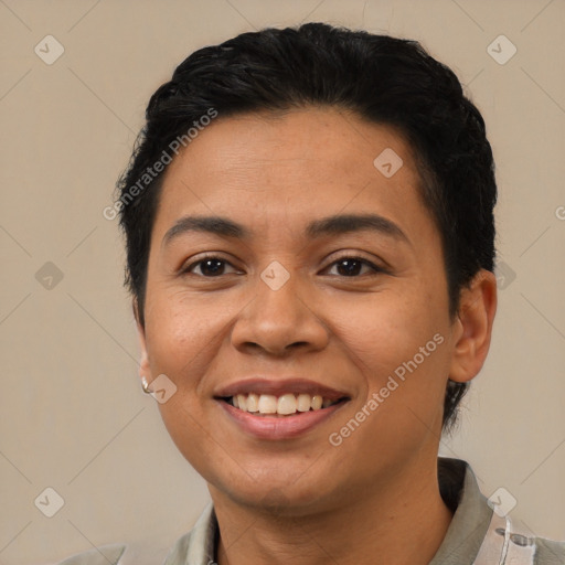 Joyful latino young-adult female with short  black hair and brown eyes