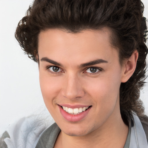 Joyful white young-adult male with medium  brown hair and brown eyes