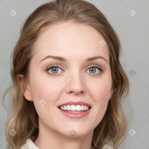 Joyful white young-adult female with medium  brown hair and blue eyes