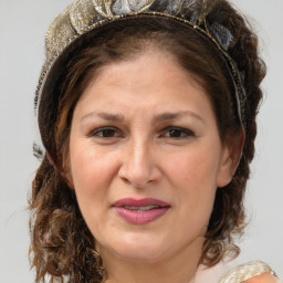 Joyful white adult female with medium  brown hair and blue eyes