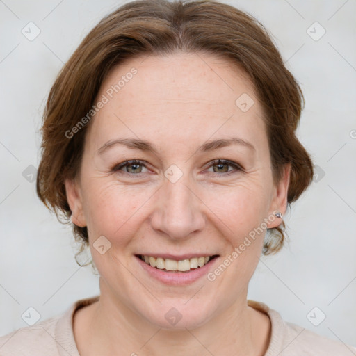 Joyful white adult female with medium  brown hair and grey eyes