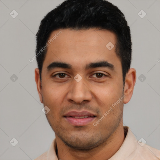 Joyful latino young-adult male with short  black hair and brown eyes