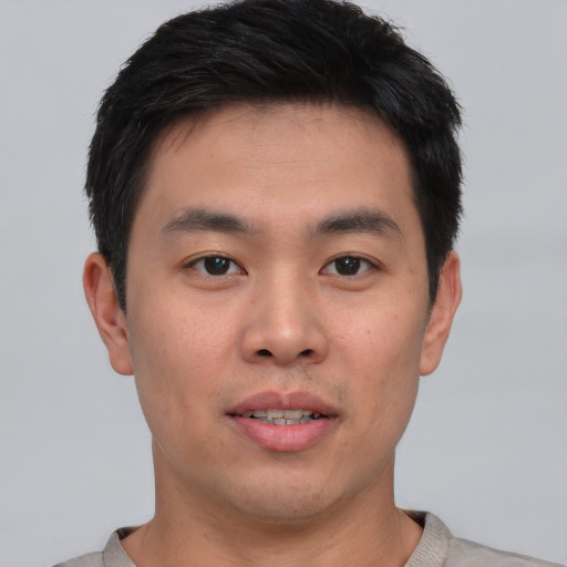 Neutral asian young-adult male with short  brown hair and brown eyes