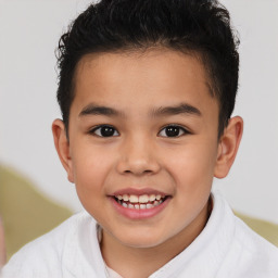 Joyful white child male with short  brown hair and brown eyes