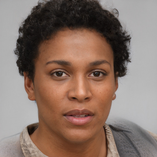 Neutral black young-adult female with short  brown hair and brown eyes