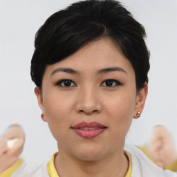 Joyful asian young-adult female with short  brown hair and brown eyes