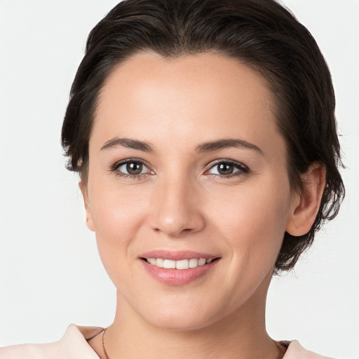 Joyful white young-adult female with medium  brown hair and brown eyes