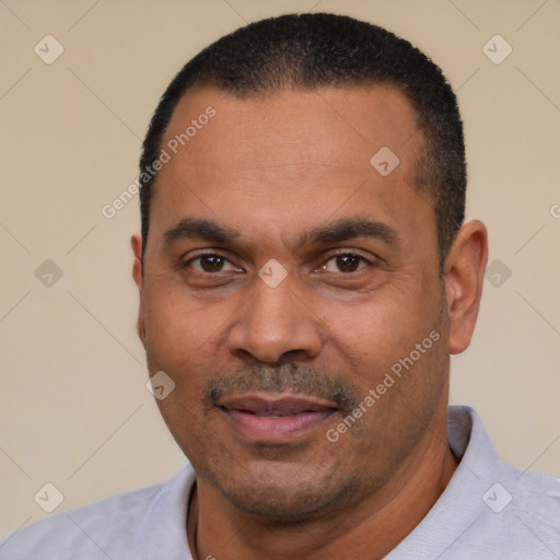 Joyful latino adult male with short  black hair and brown eyes